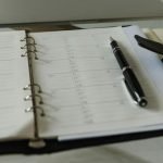 Paper planner ready to book a day for an appointment.