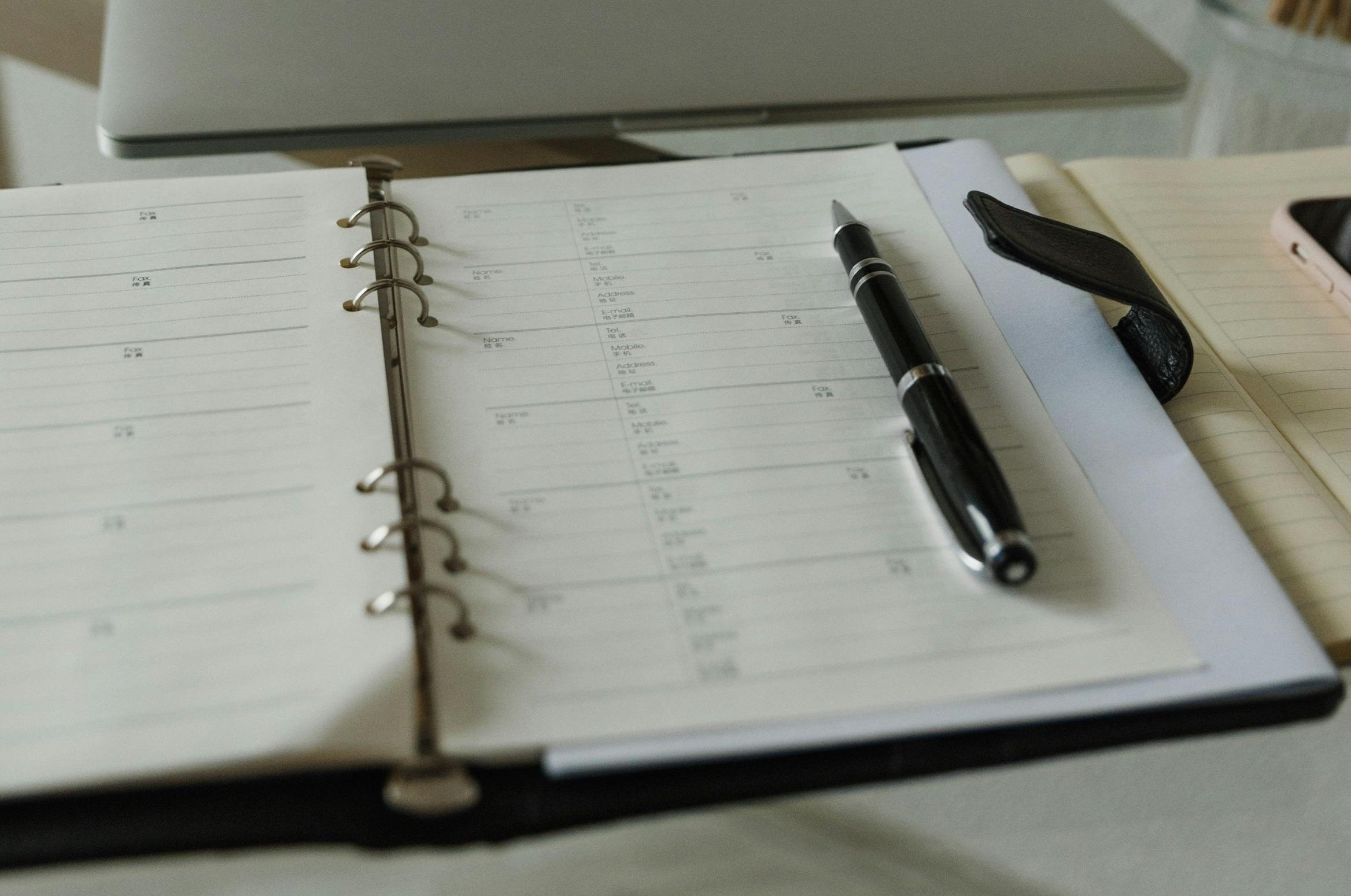 Paper planner ready to book a day for an appointment.